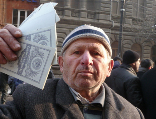 Участник шествия против внедрения закона о новой пенсионной системе. Ереван, 18 января 2014 г. Фото Армине Мартиросян для "Кавказского узла"