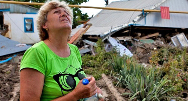 Жительница Крымска, пострадавшая от наводнения. Краснодарский край, 11 июля 2012 г. Фото: Юрий Гречко / Югополис