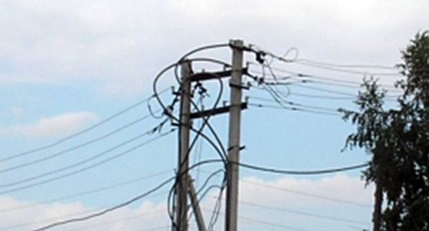 Поврежденные ЛЭП. Фото: http://www.08.mchs.gov.ru/upload/site34/document_operational/Drs4qRBkHx-big-350.jpg