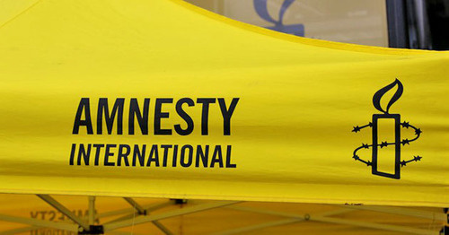 Логотип правозащитной организации Amnesty International. Фото пользователя Metropolico.org flickr.com 