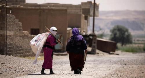 Женщины с белым флагом в провинции Ракка, Сирия. Фото Rodi Said/Reuters