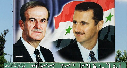 Плакат с портретами Хафеза (слева) и Башара Асад. Фото: Reuters/Jamal Saidi