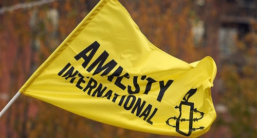 Флаг Amnesty International, фото: пресс-служба https://www.amnesty.eu/